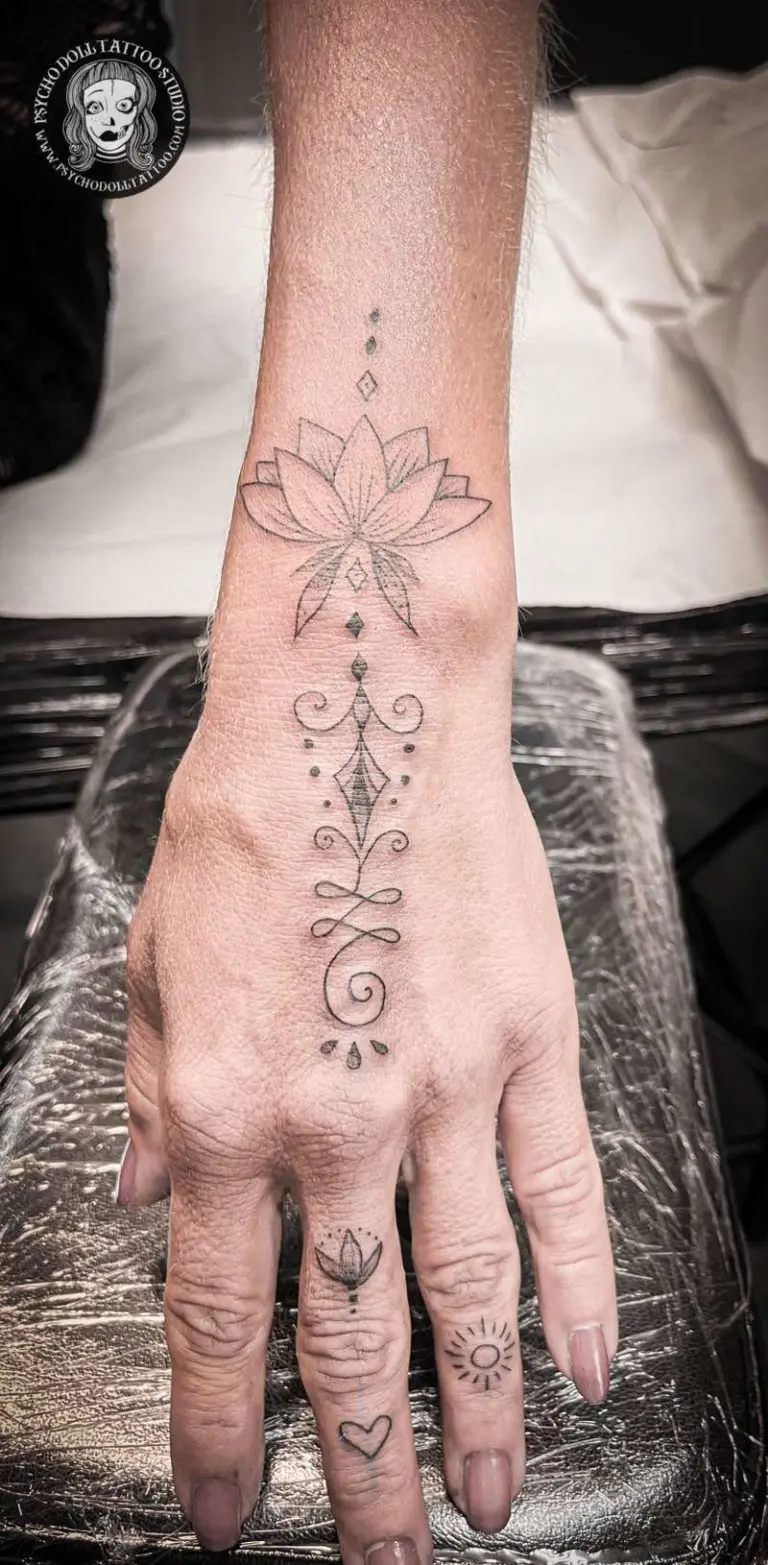 lotus flower with decorations tattoo