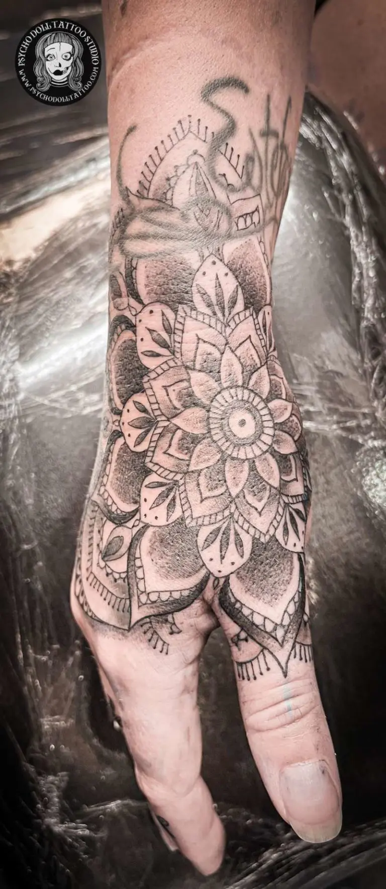 mandala hand tattoo