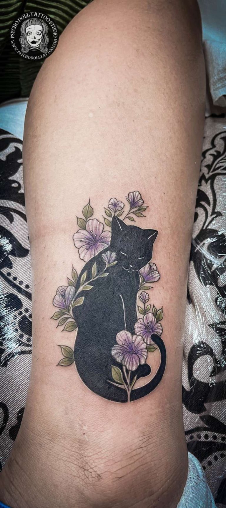 Cover up tattoo with cat and flowers